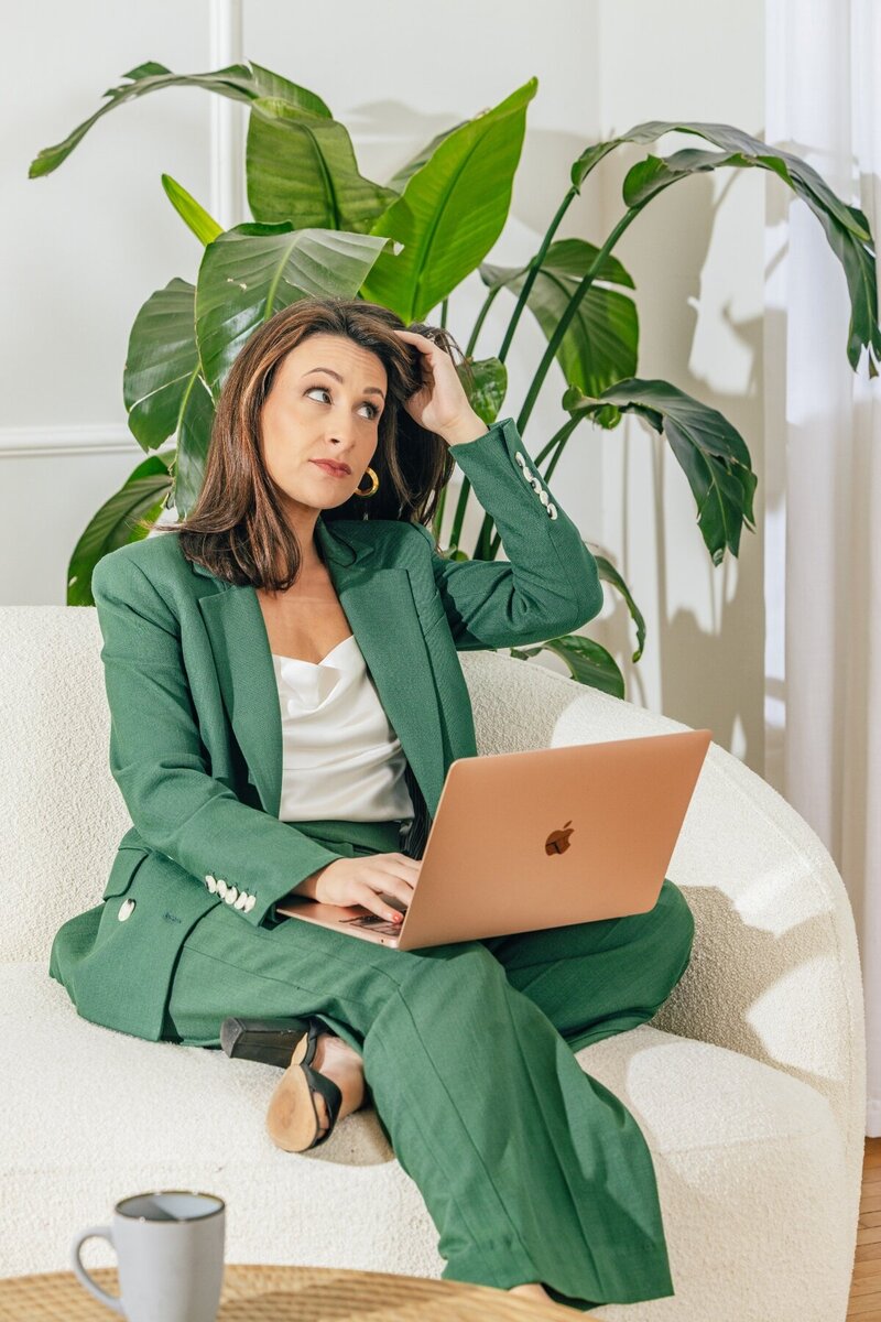 Julia Korn in Green Blouse On Couch