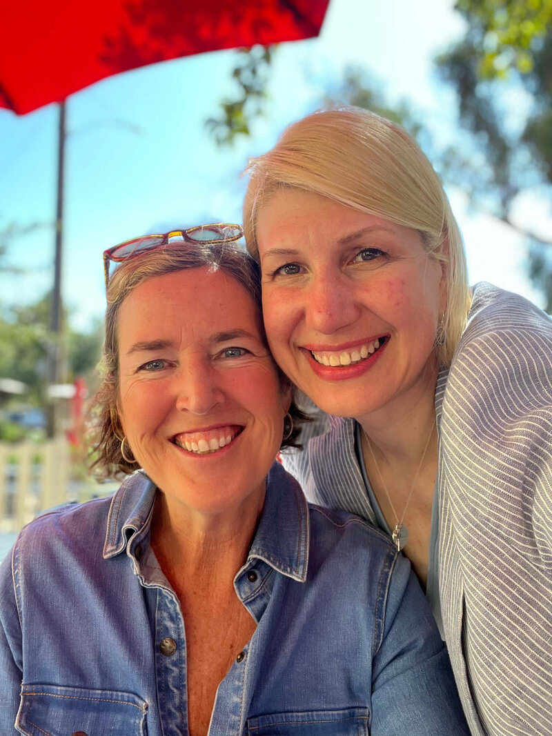 Two women enjoying a sunny day in Santa Barbara, symbolizing real-life joy, ease, and the lightness that follows deep inner work
