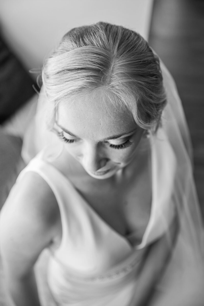 Bride wearing veil looking down to show makeup | Klein Wedding in Harmony, Maine