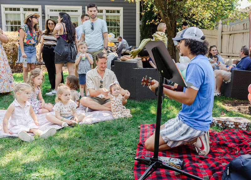 Musician playing for guests at a family celebration
