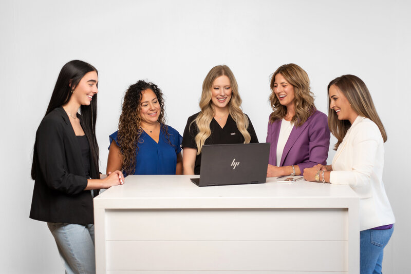 Marketing professionals show a presentation to their clients for a candid branding photo