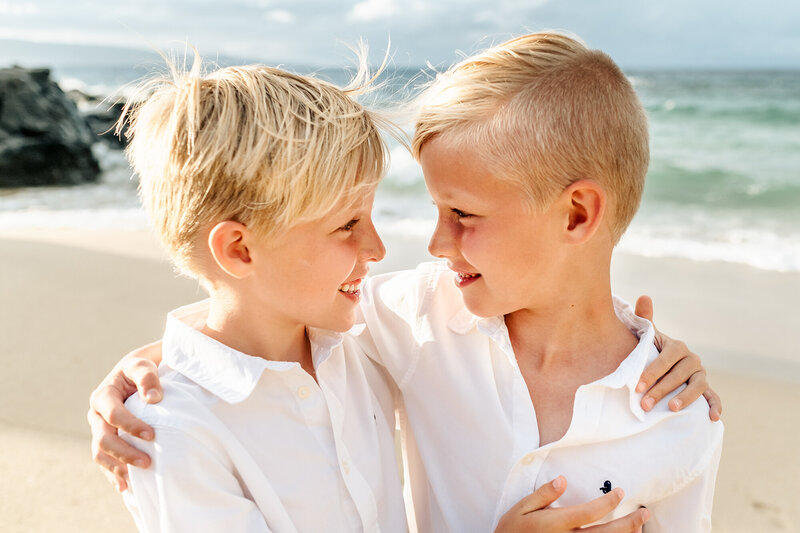 Denver Family Photographer captures brothers looking at one another during fall family photos