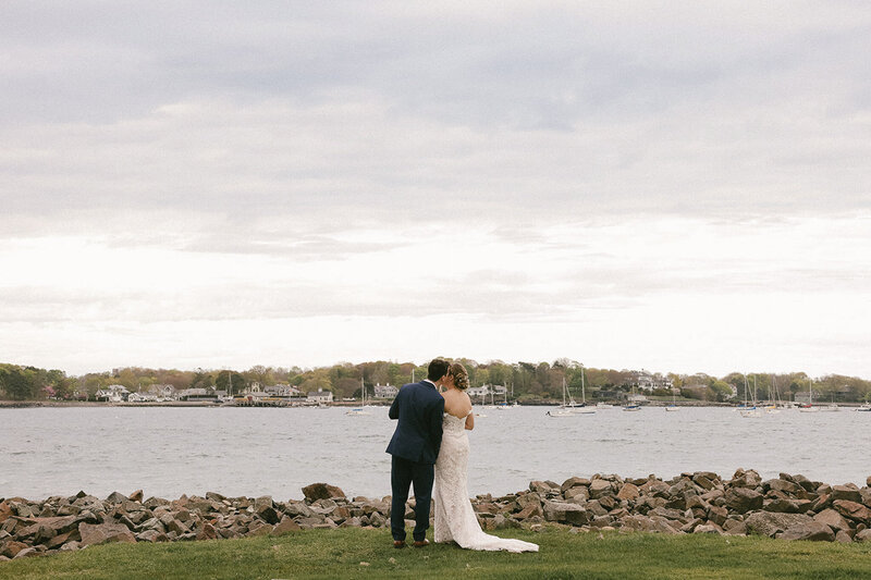 Couple overlook the arbor on their wedding day in Boston, MA at the Oceanview venue. 