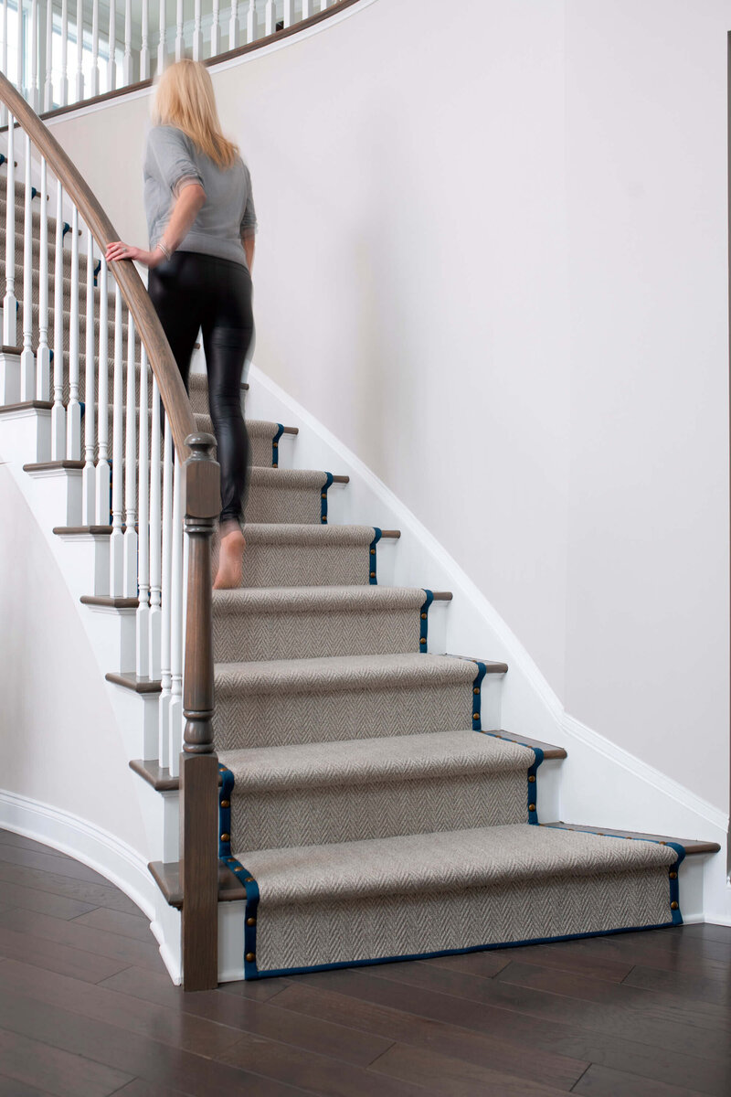 Townhouse transformation by Glass House Design Group | Creative solutions for 55+ community living featuring layered textiles, wall art, and custom décor. Massachusetts interior design making cold, empty rooms feel warm and finished.