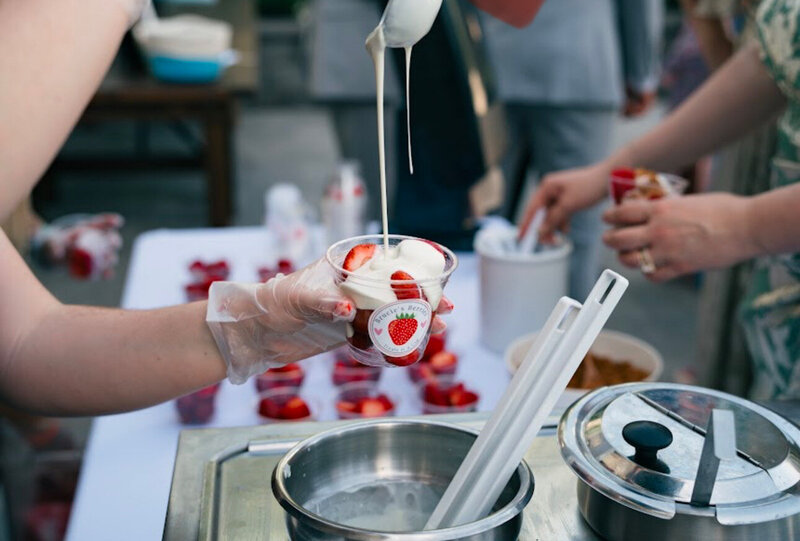 Chocolate drizzled strawberries in a cup