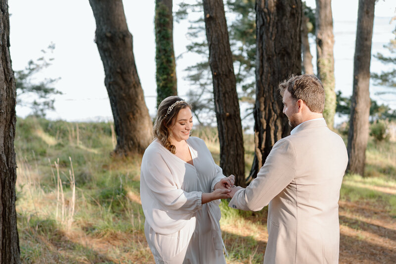 Couple reading hand written letters from loved ones on their destination elopement day