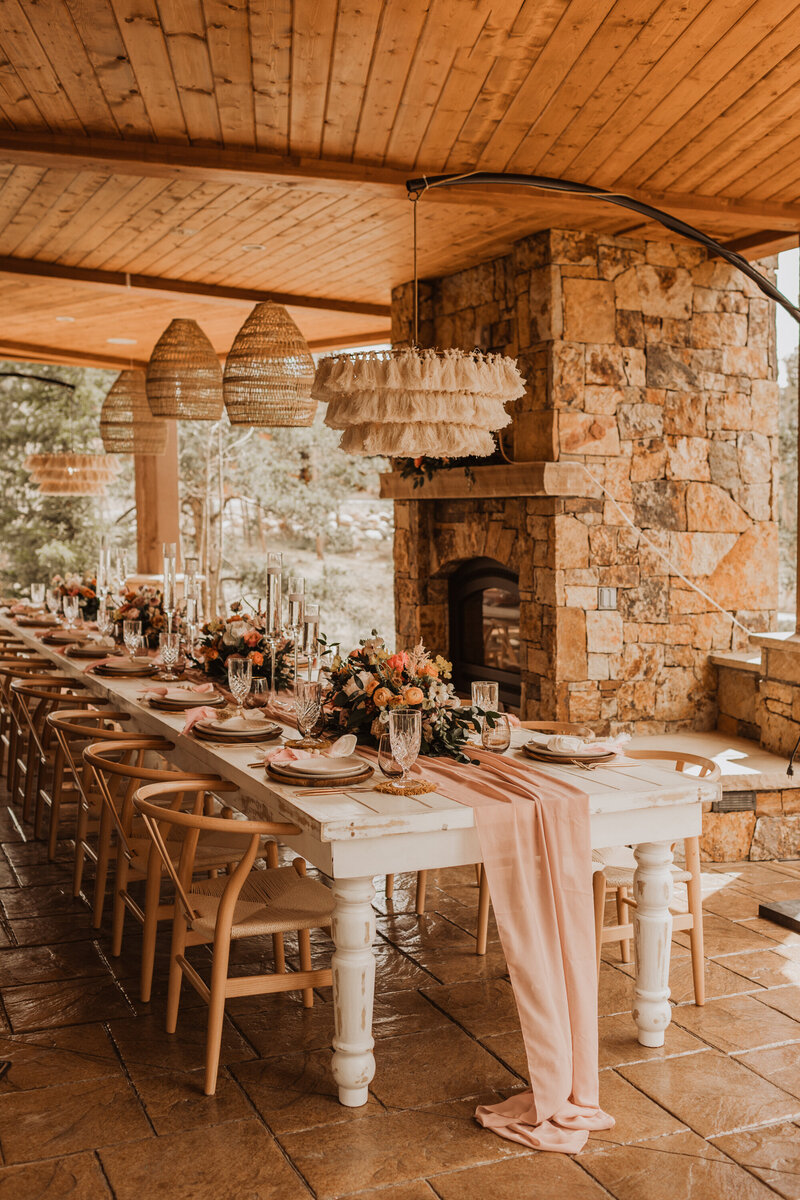 Table set up next to a stone fireplace