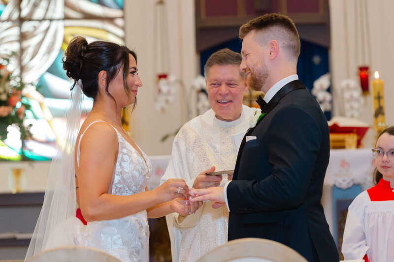 Ottawa wedding photography showing a church wedding where the bride and groom are exchanging their rings