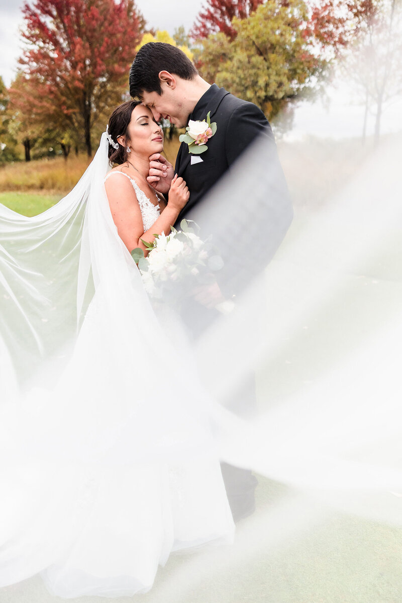 Bride and groom embrace at Funks Grove in Mclean, Illinois.