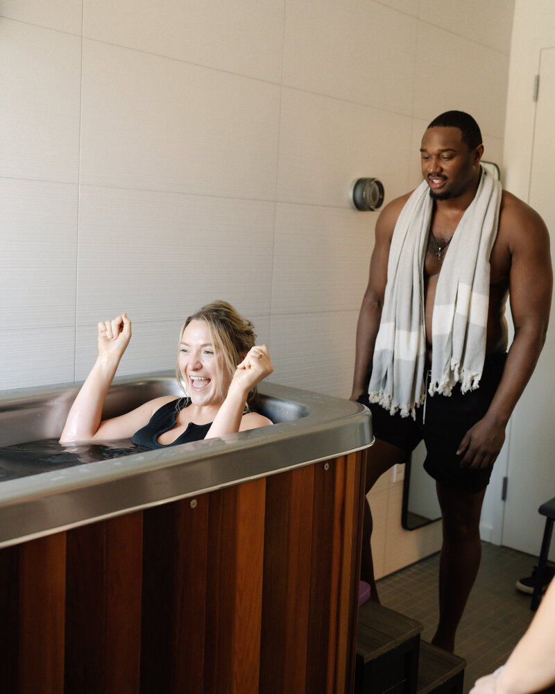 Happy man relaxing with towel after sauna session at Dahlia wellness center