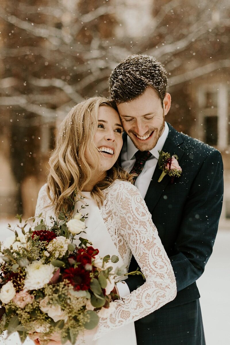 Bride and groom outside in the snow in Alberta