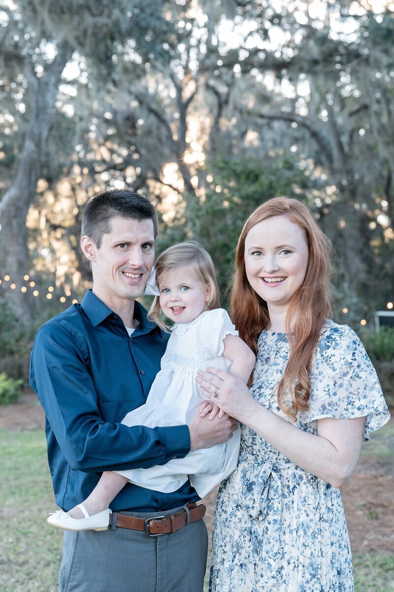 family smiling together taken by family photographers in savannah ga

