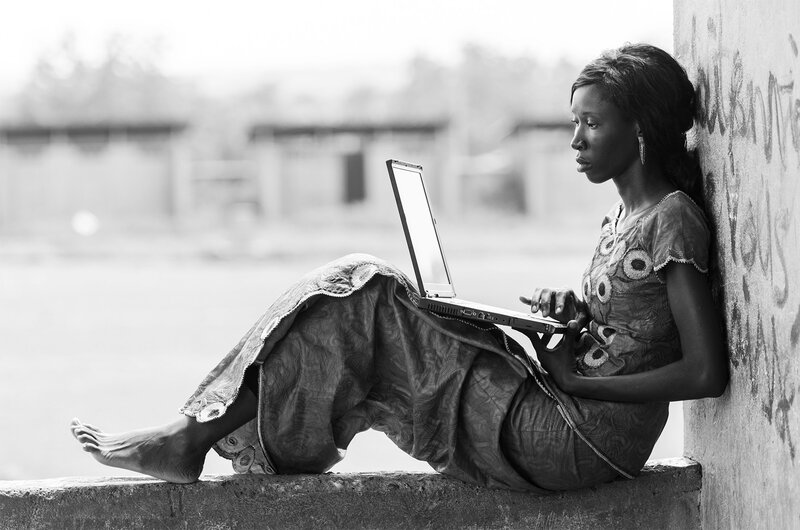 Young adult lady looking at a computer