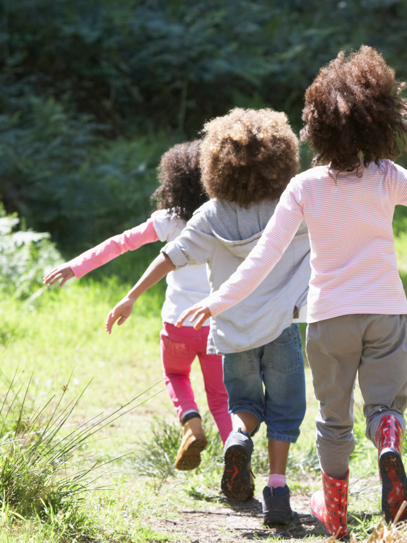 kids running in field 