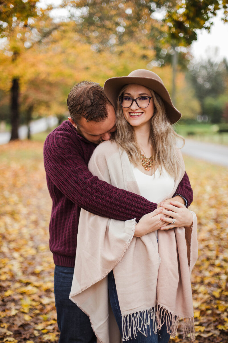 man and woman hugging during outdoor engagement session