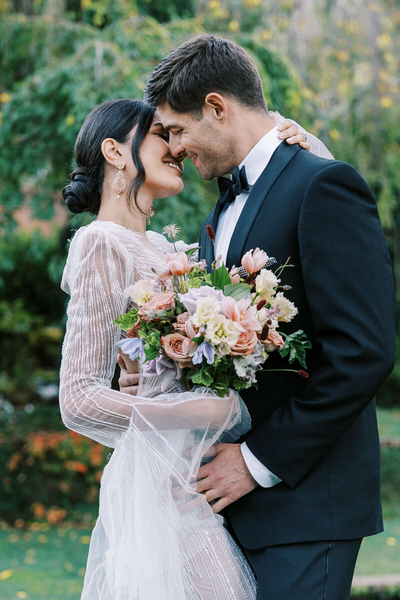 Bride and Groom smiling for a kiss