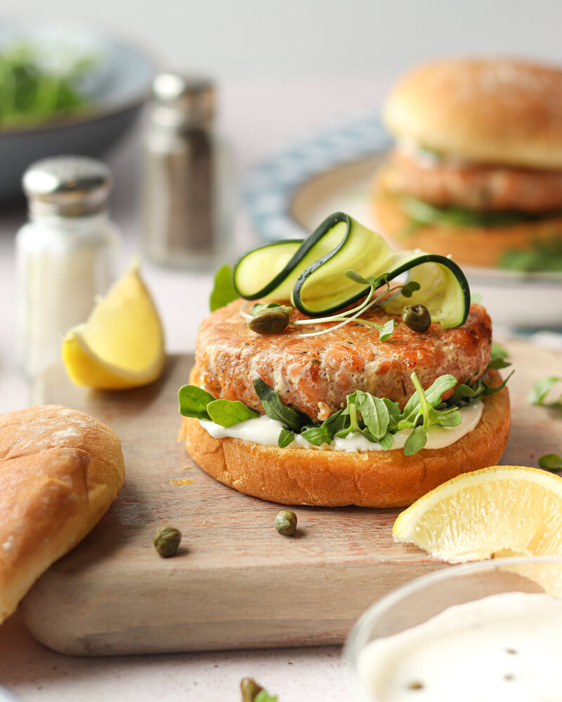 a burger topped with a pickle