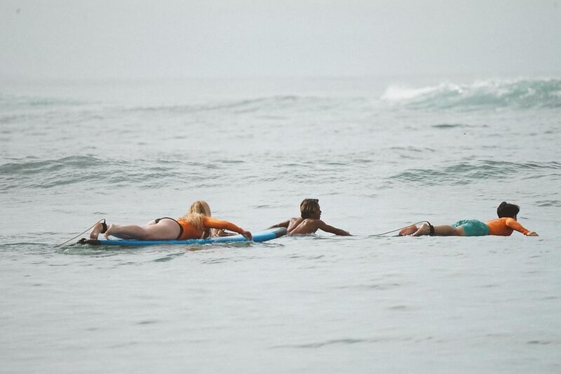 A group of excited students getting ready for their surf session at Mantra Surf Bali.