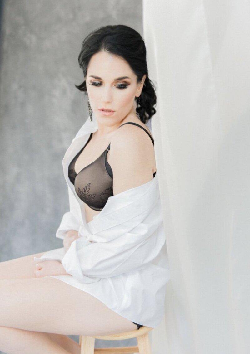 Softly lit boudoir portrait showcasing timeless grace and confidence.