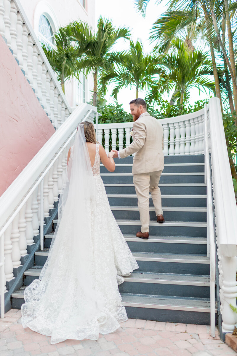 Bride and groom walking upstairs at The Don Ceaser, Sarasota