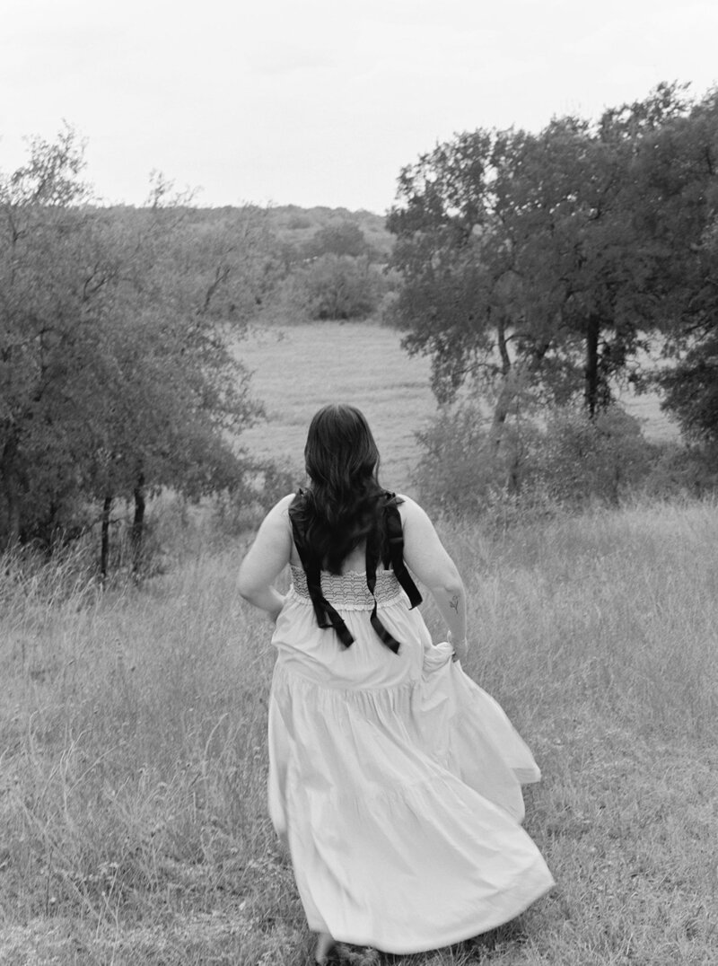 Mikaela Kahn running through a field