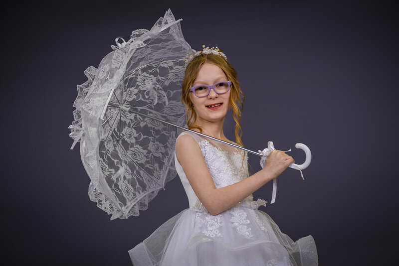 Communion girl photo with parasol