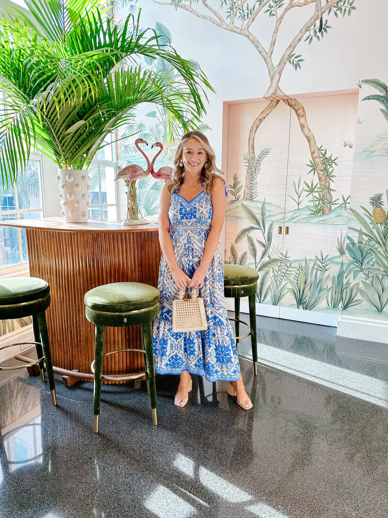 Marie posing by a coastal themed bar area