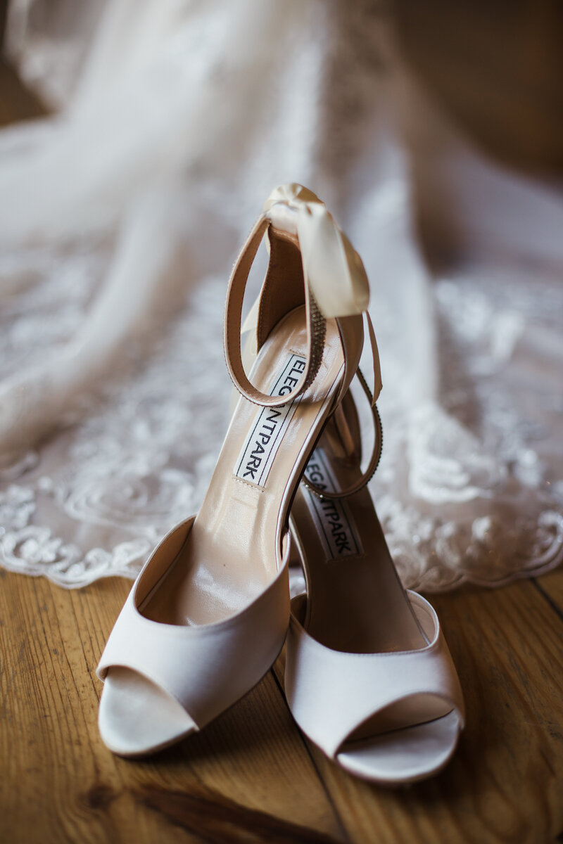 bridal shoes and wedding dress detail shot