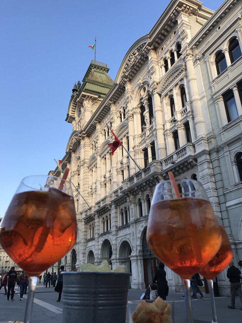 Spritz at a cafe in Piazza Unita in Trieste, Italy. Trieste travel at its best.