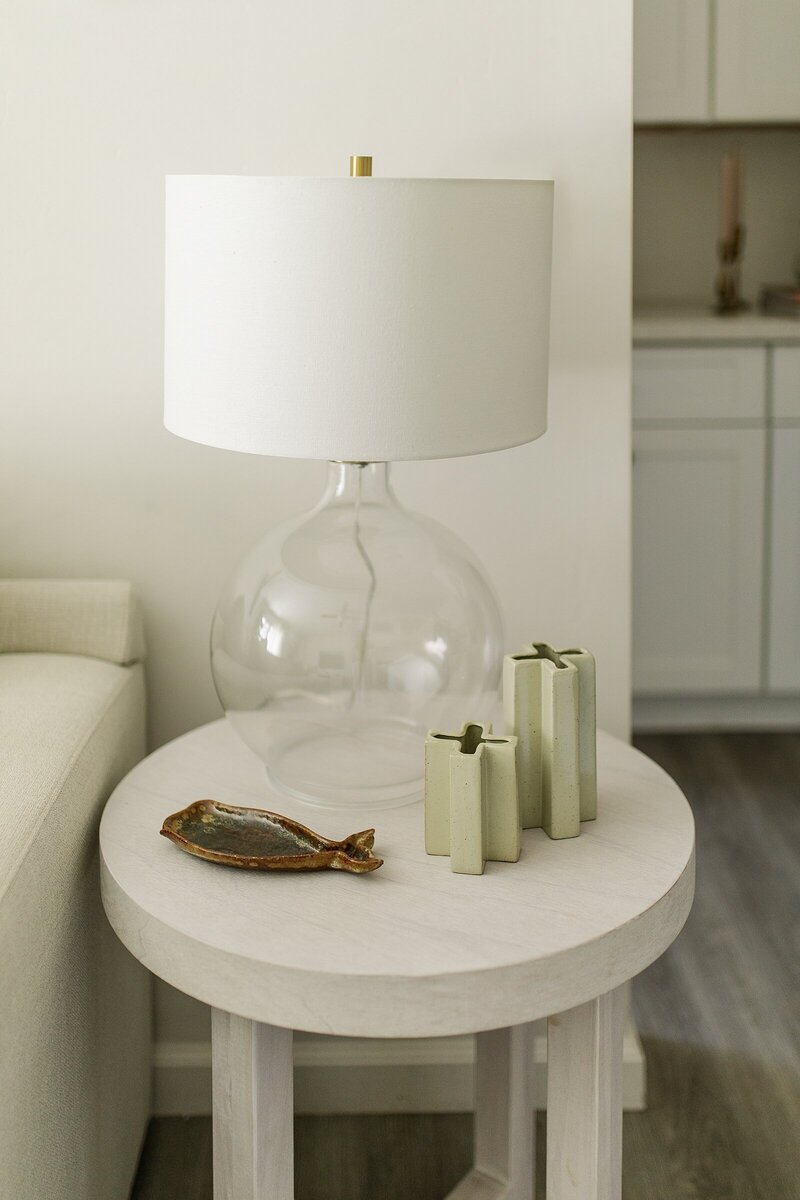 Basket holding plush blanket under console table in Vista, California.