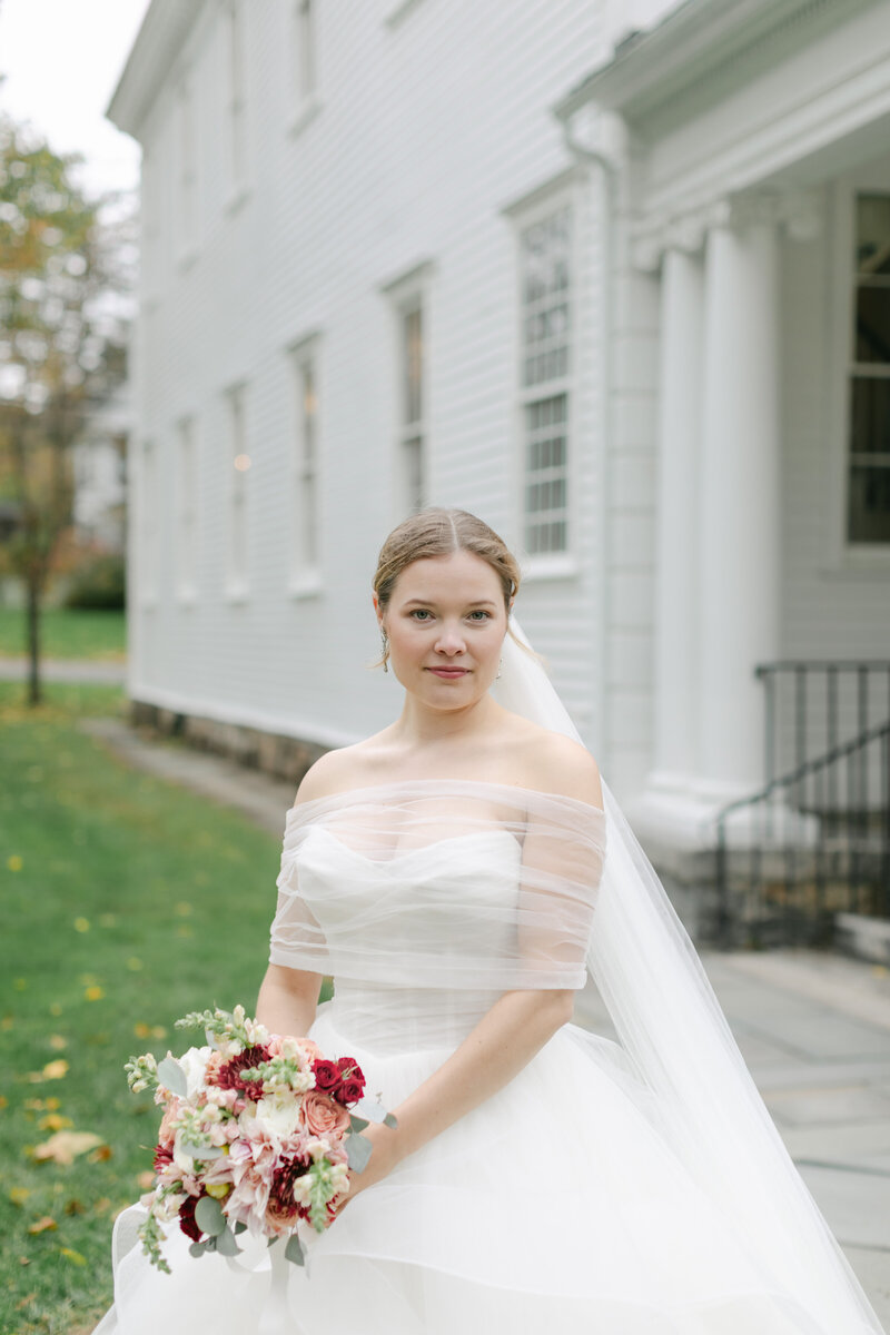 bride-holding-fall-bouquet-church