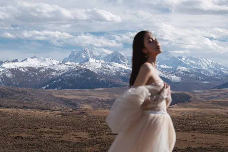 Couture bride shot in dramatic mountain scape.