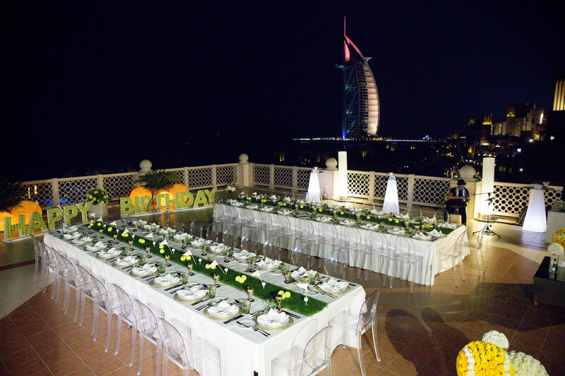 Wedding reception tables set up outside at night in Dubai