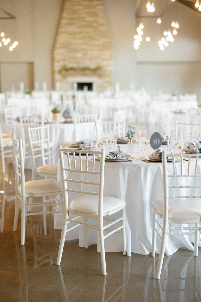 Reception decor in Canyonwood Ridge hall with romantic lighting and Hill Country details
