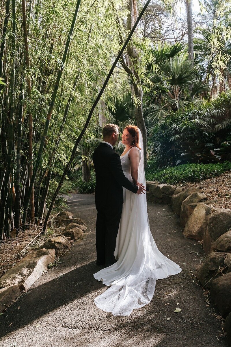 A bride and a groom in the botanical gardens