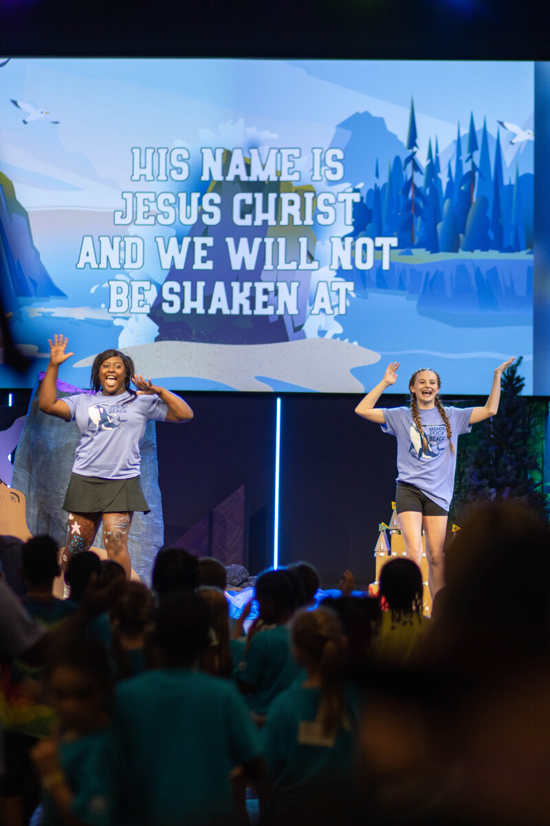 Group of kids worshipping at Vacation Bible School at a non-denominational church in Fayetteville, NC.