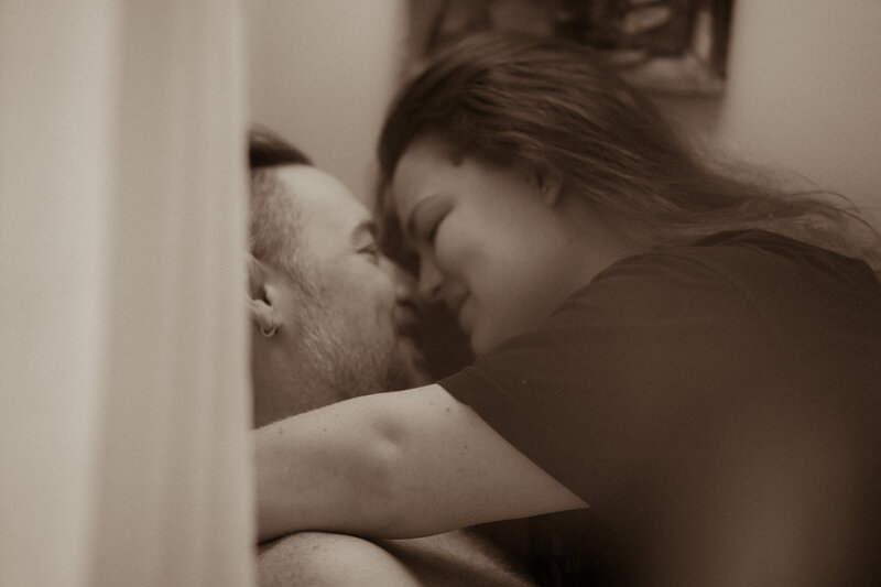 Intimate image of bride and groom together before their ceremony with a slow shutter speed.