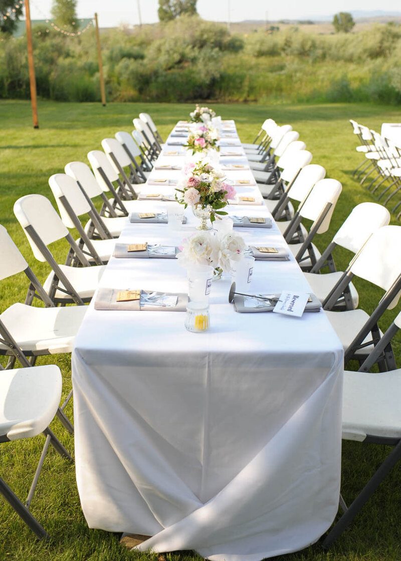 Outdoor table setting at Wyoming ranch wedding venue