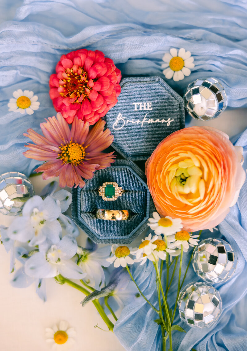 Wedding detail photo and ring box with florals from Wild Alpine Floral captured by Dear Kodak Photography