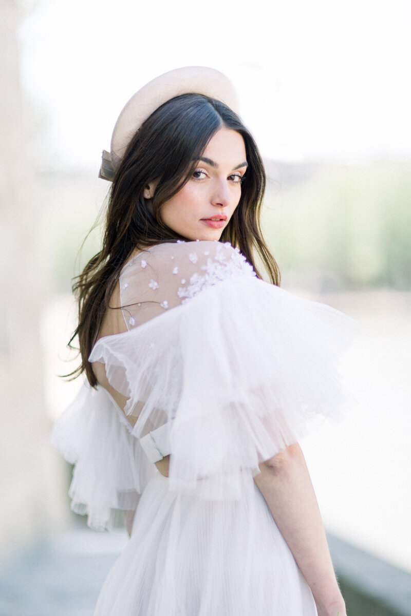 portrait of bride looking over her shoulder in Paris