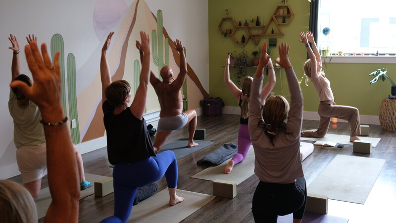 Ariane smiling in a filed of flowers