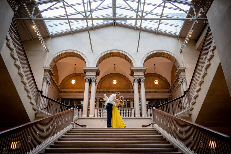 Bride and Groom Kissing on Kedzie Street Bridge in Downtown Chicago with Bride's veil blowing in the wind.