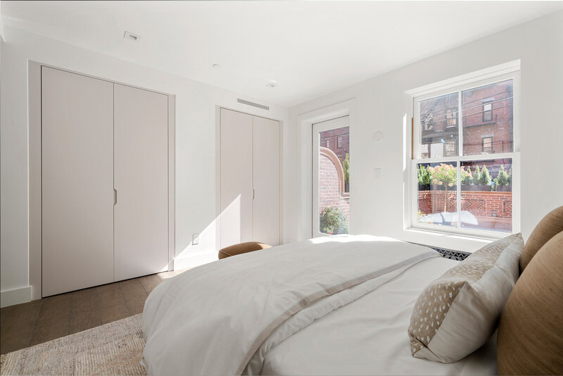 Guest bedroom at Maison Commonwealth with Itlaian closets