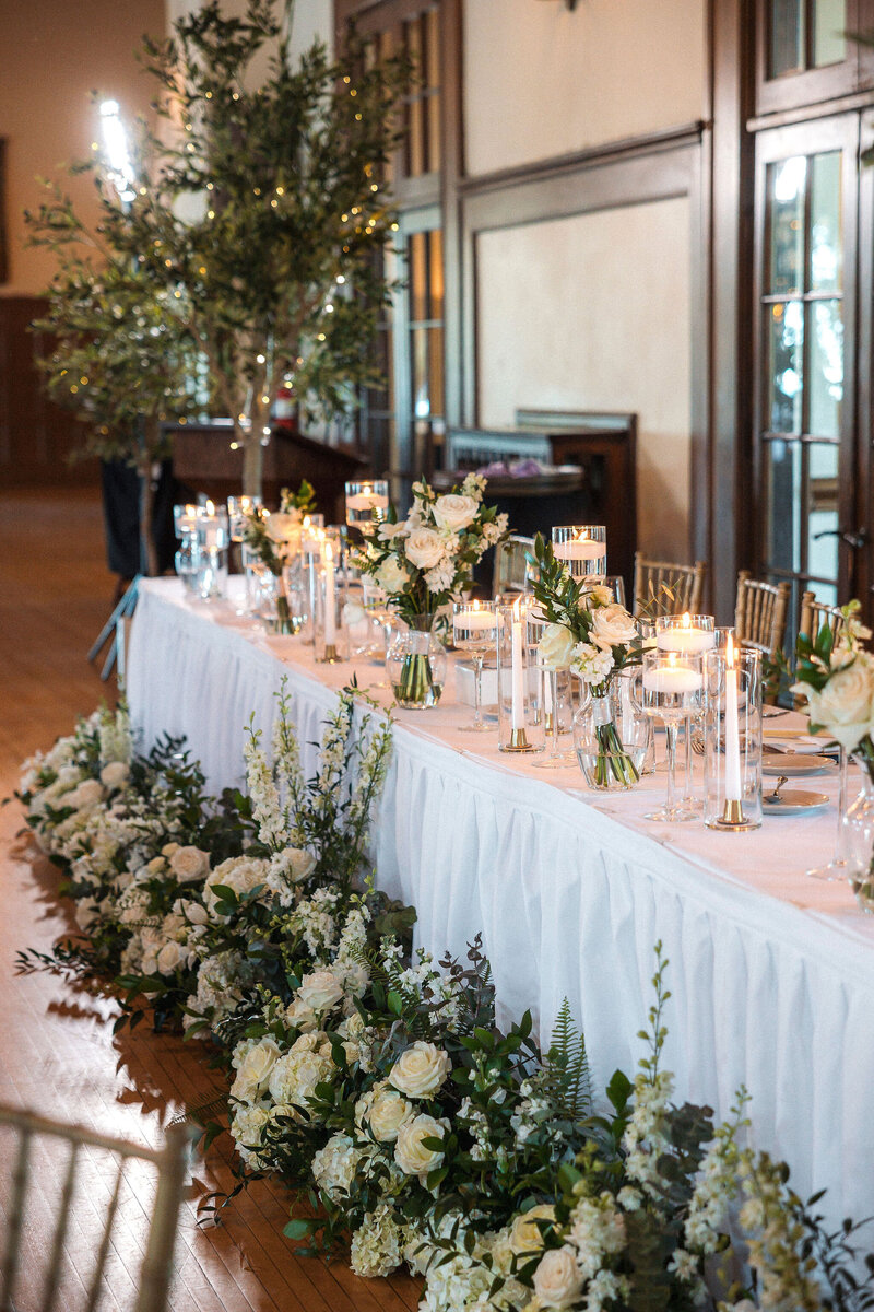Bud vases with white flower stems