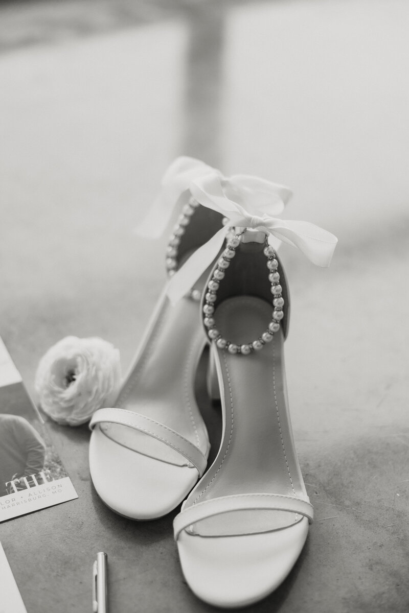 A pair of pearl wedding shoes.