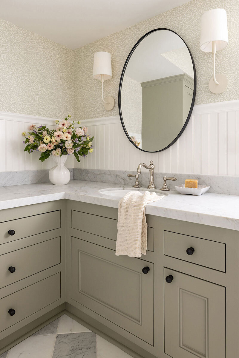 Bathroom space featuring personalized interiors and traditional cottage details
