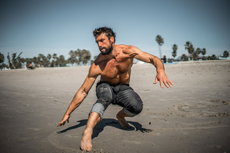 man working out on beach