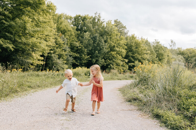 The Sage kids running together outdoors, laughing and full of energy.