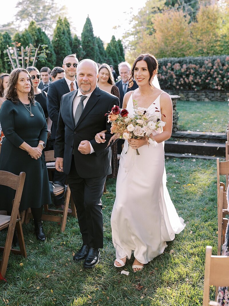 Beautiful sunny ceremony at Shadow Creek at Virginia wedding venue captured by Sarah Botta Photography