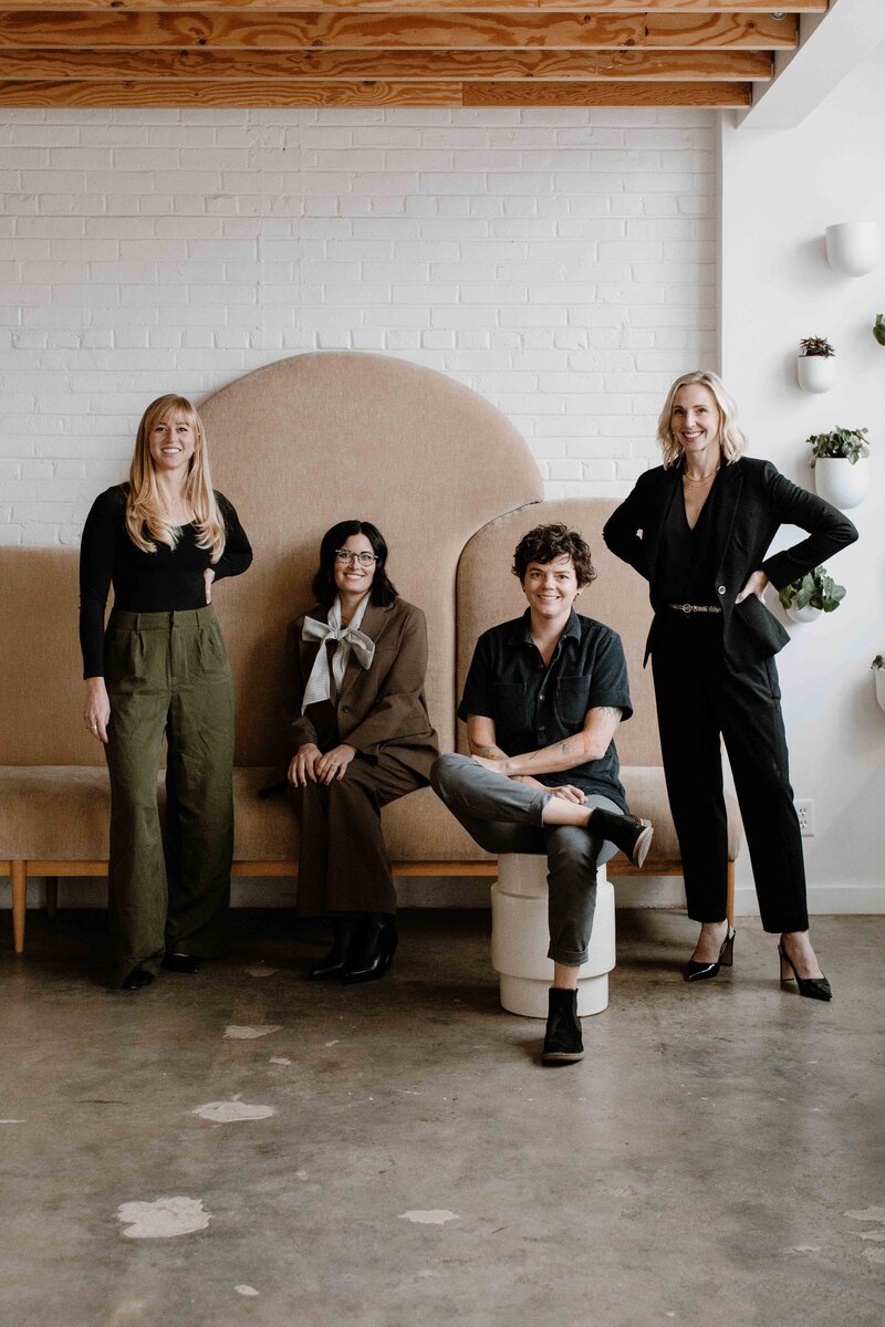 Peak Interactive Wellness nurse practitioner team in Denver and Greenwood Village, standing together in a welcoming clinic space and providing holistic psychiatric care.